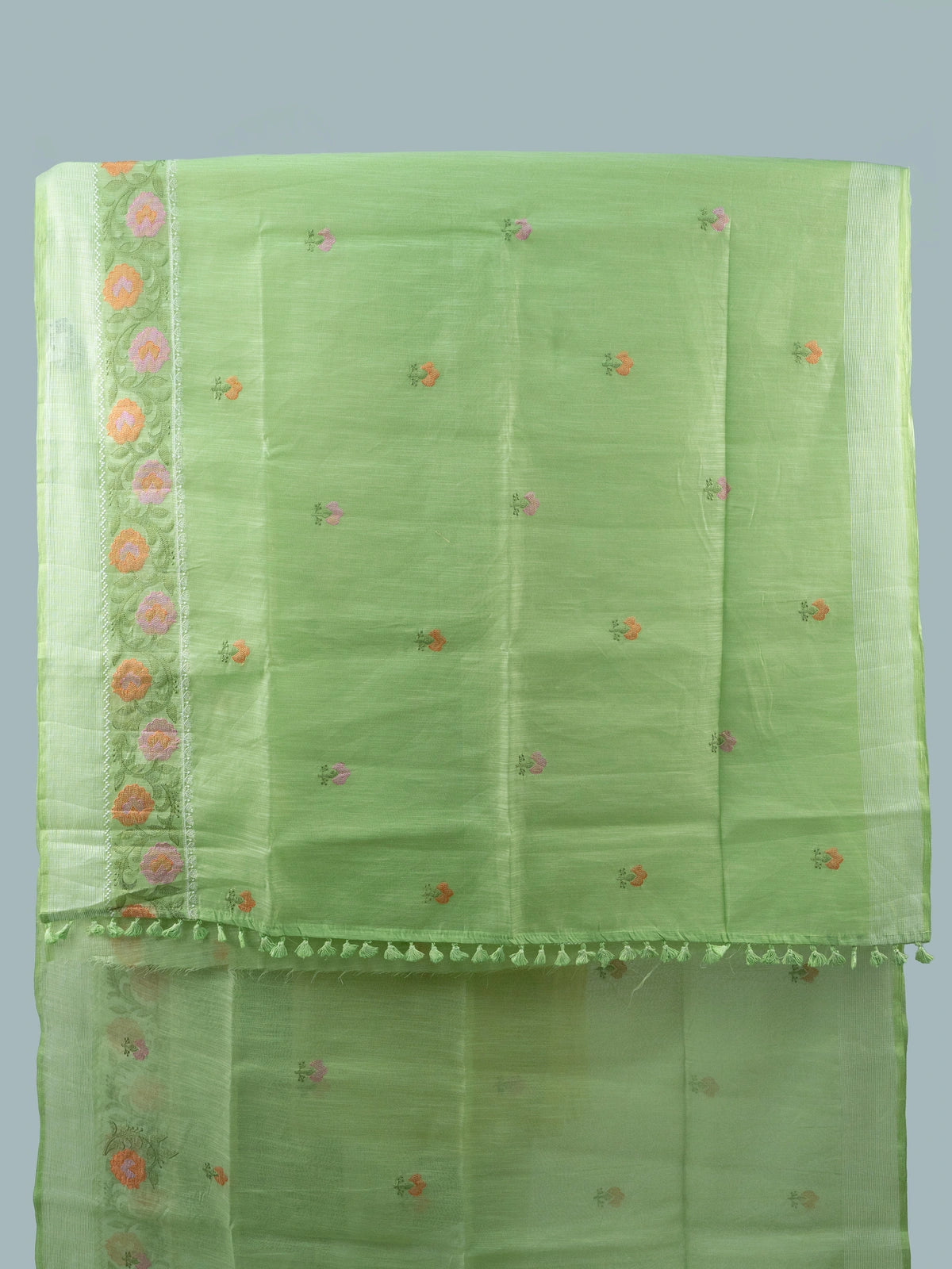 Light green linen cotton saree with silver zari border and multicoloured floral embroidery