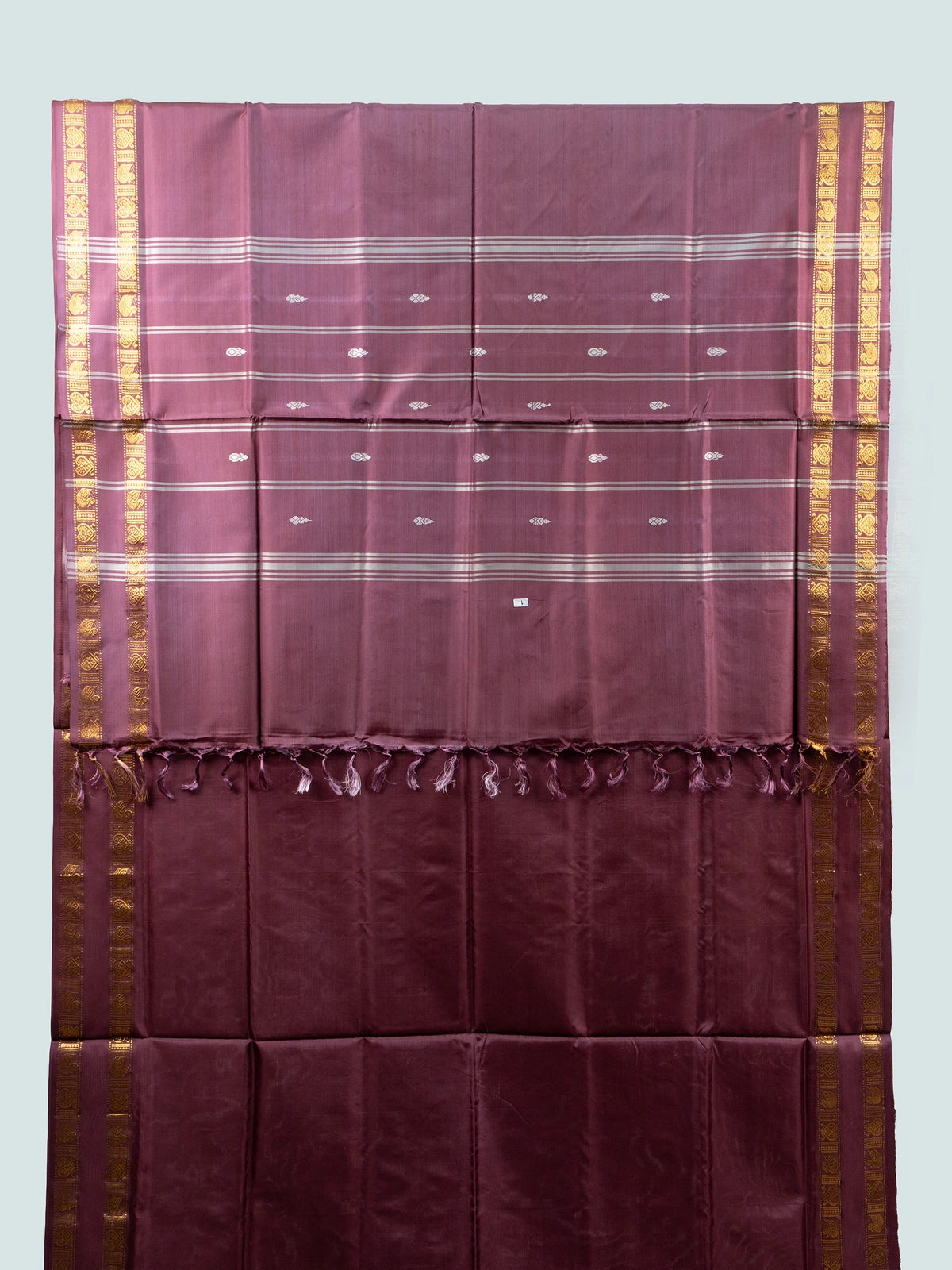 Wine maroon banana silk saree with gold zari border, silver buttas and contrast black blouse