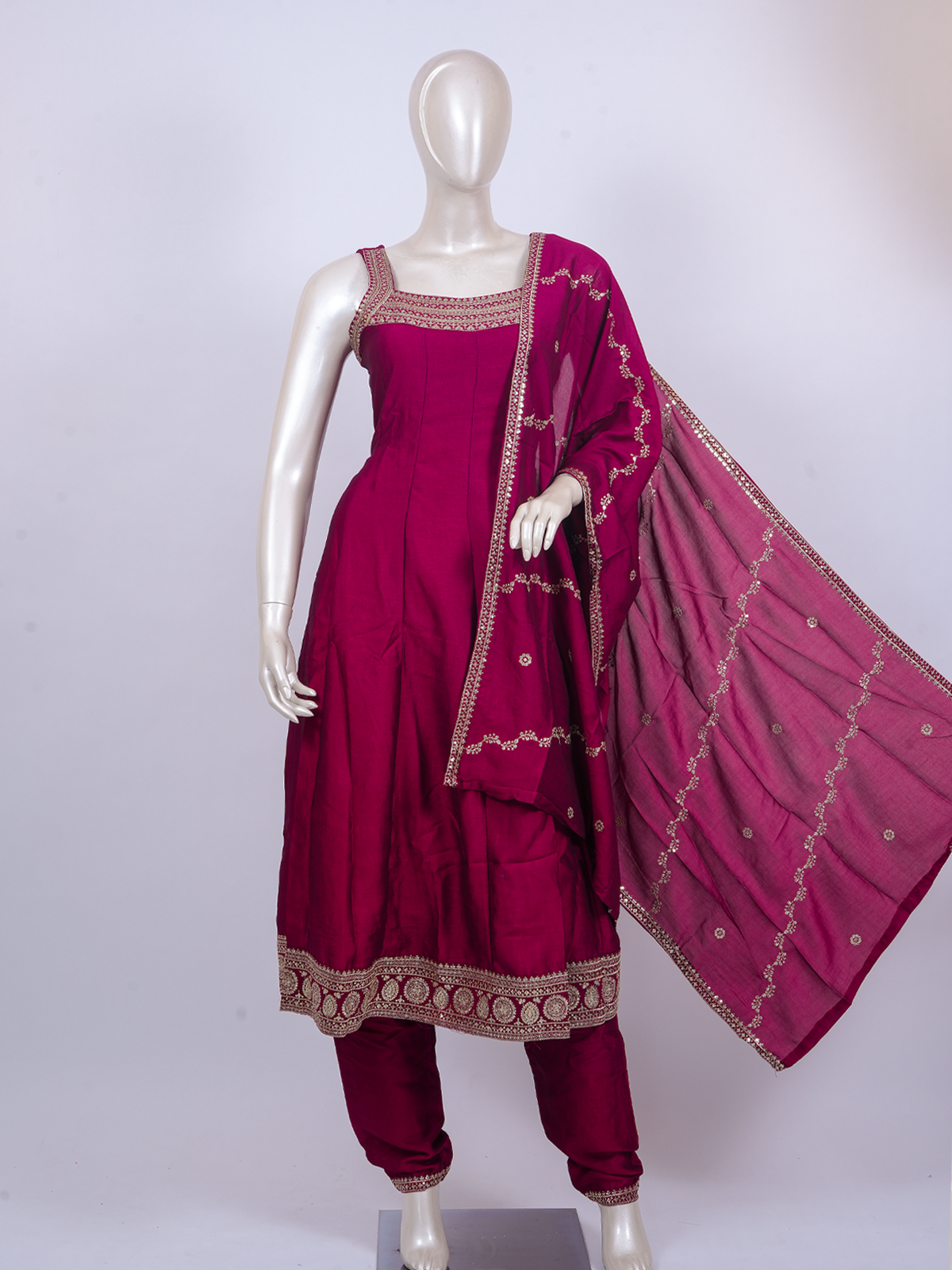 Rani Pink zari embroidered sleeveless A-line kurti set with straight pants and matching embroidered dupatta