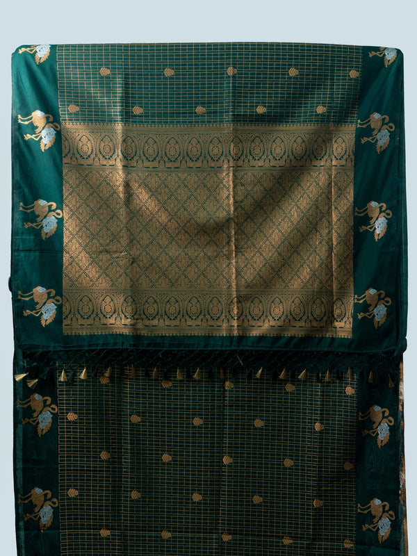 Bottle green semi raw silk saree with gold zari checks, yali motifs and contrast black embroidered blouse