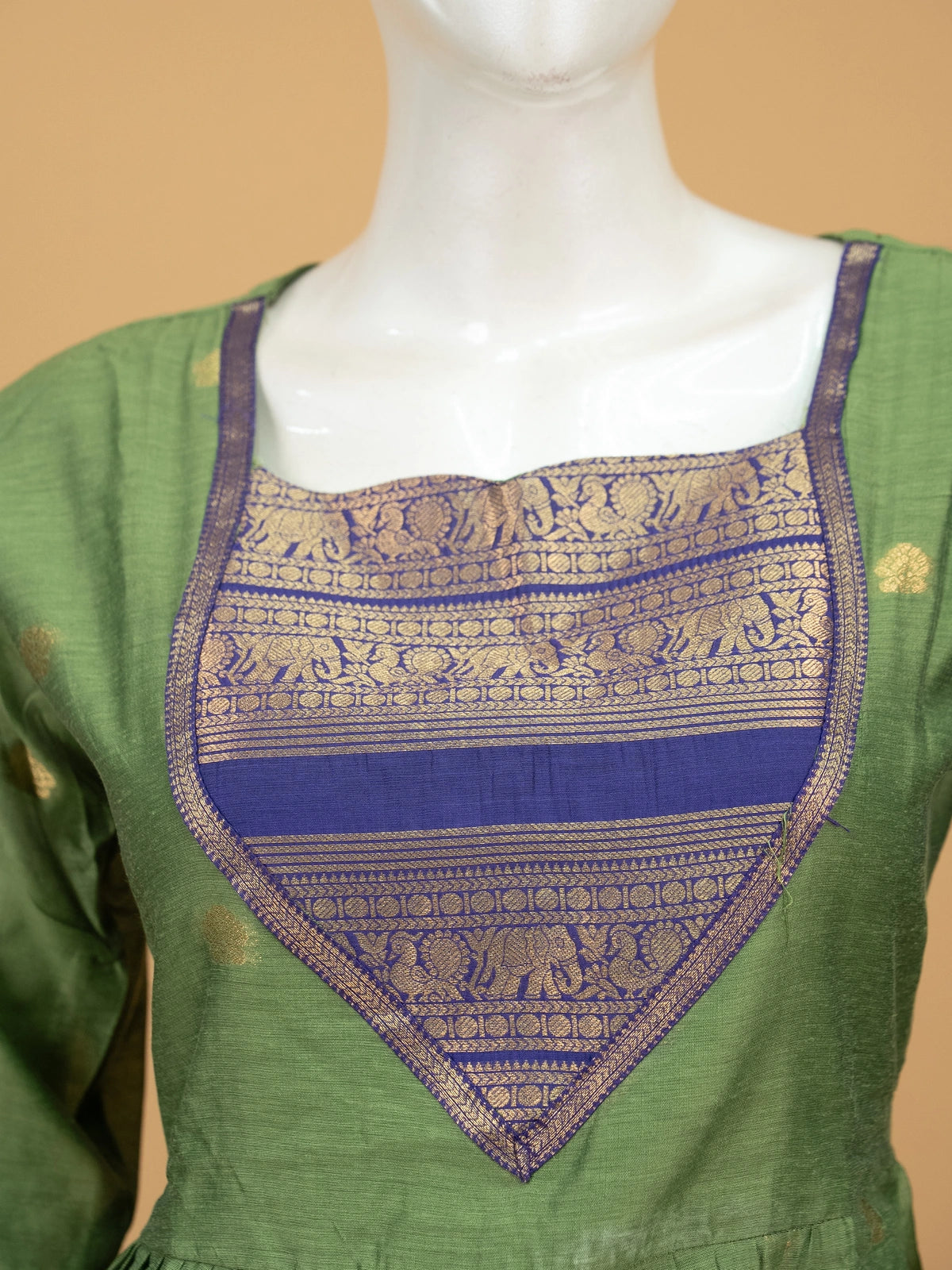 Green cotton silk Anarkali kurti set with navy zari woven yoke, elephant-motif border, and contrast navy dupatta