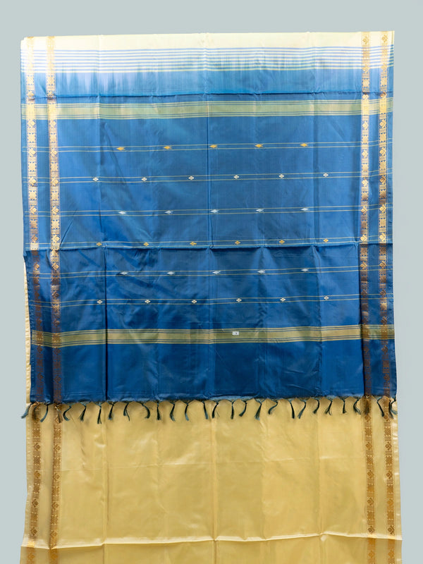 Cream and blue banana silk saree with gold zari border and contrast blue pallu