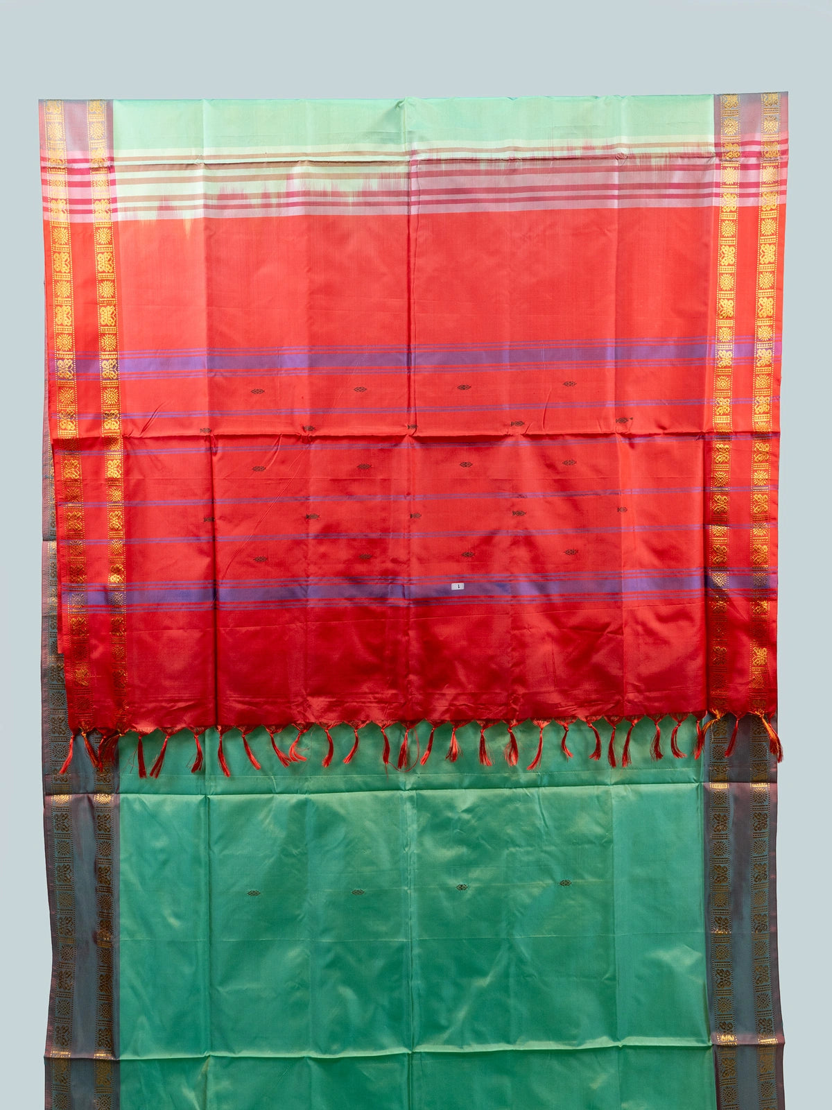 Sea green banana silk saree with contrast red pallu and gold zari border