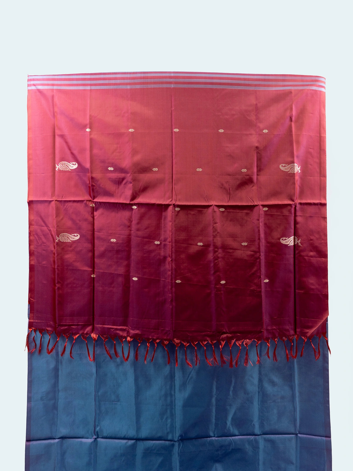 Blue and rani pink banana silk saree with gold zari paisley motifs and contrast pallu