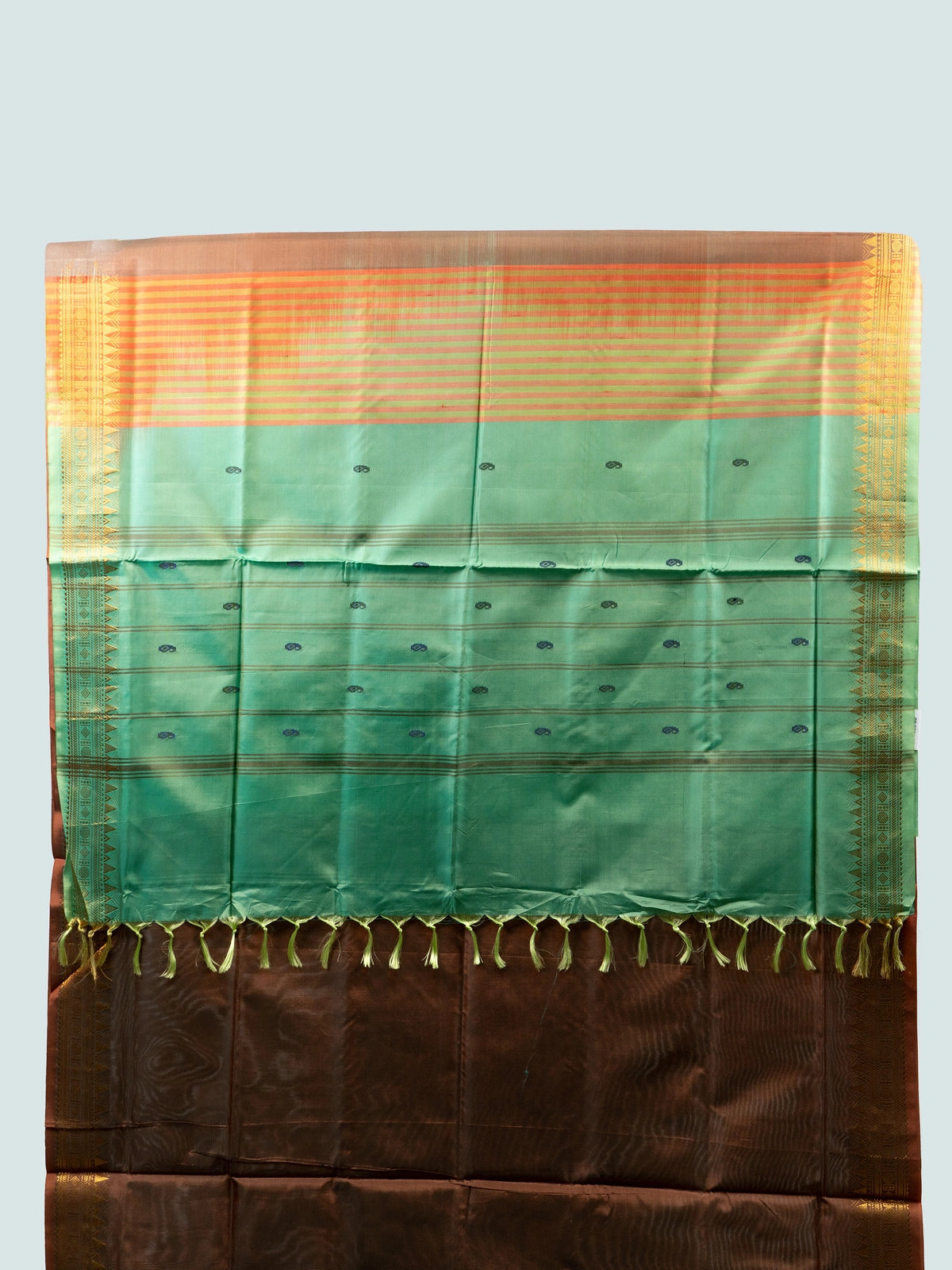Brown banana silk saree with gold zari border and contrast green striped pallu