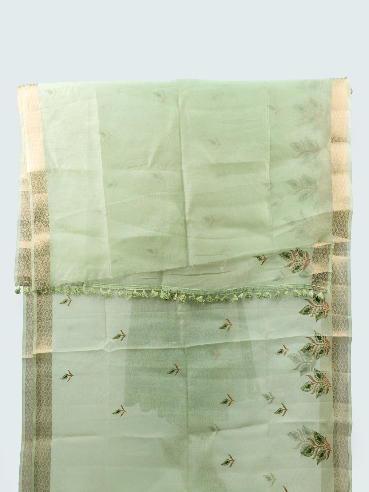 Pista green linen cotton saree with gold zari border, embroidered leaf buttas and contrast black embroidered blouse