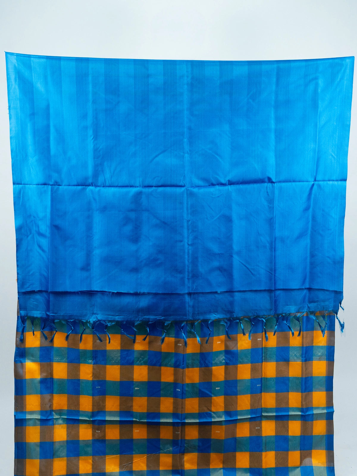 Blue and yellow checked banana silk saree with solid blue pallu and silver zari motifs