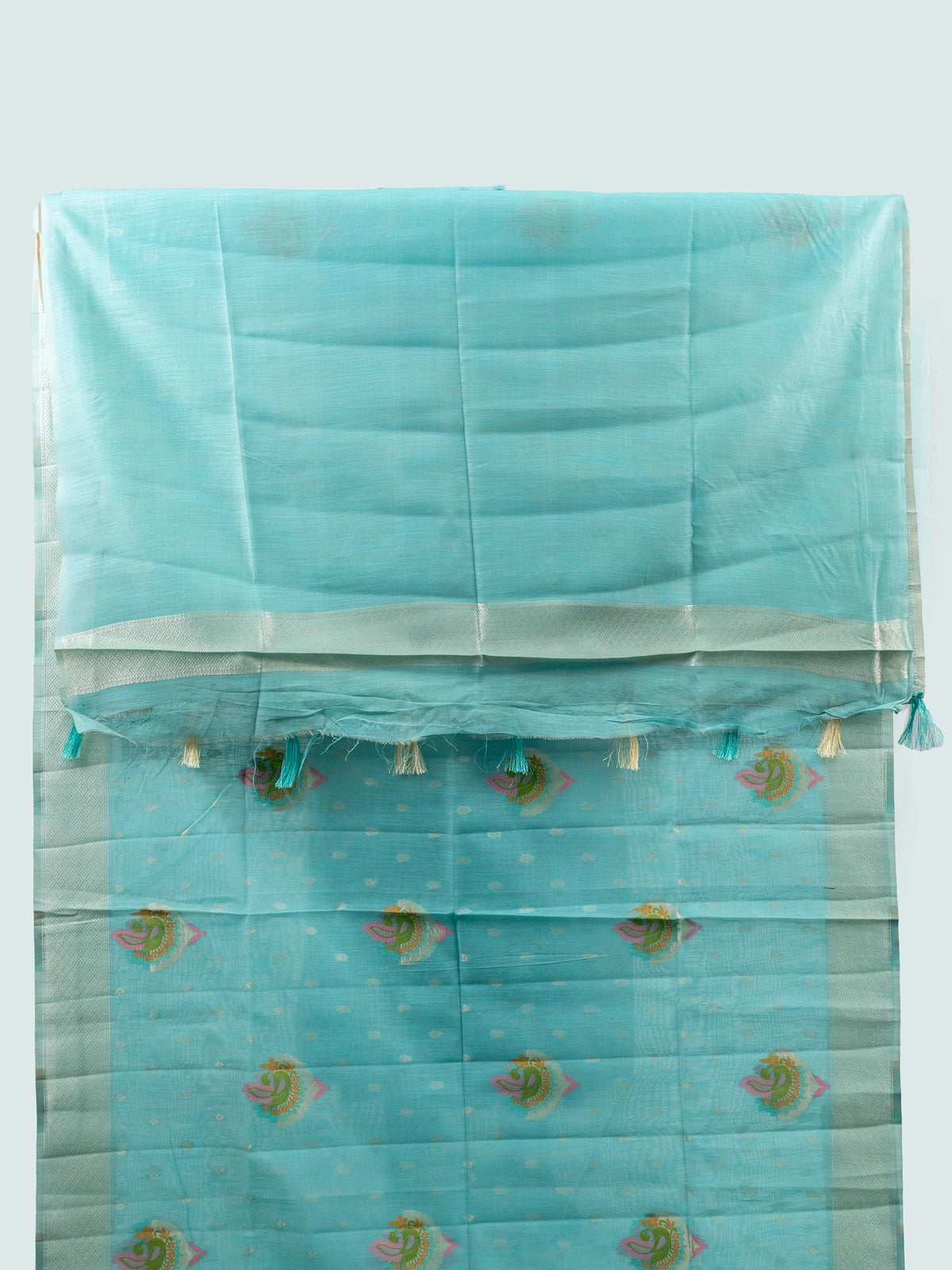 Aqua blue linen cotton saree with silver zari border, colourful peacock motifs and contrast black blouse