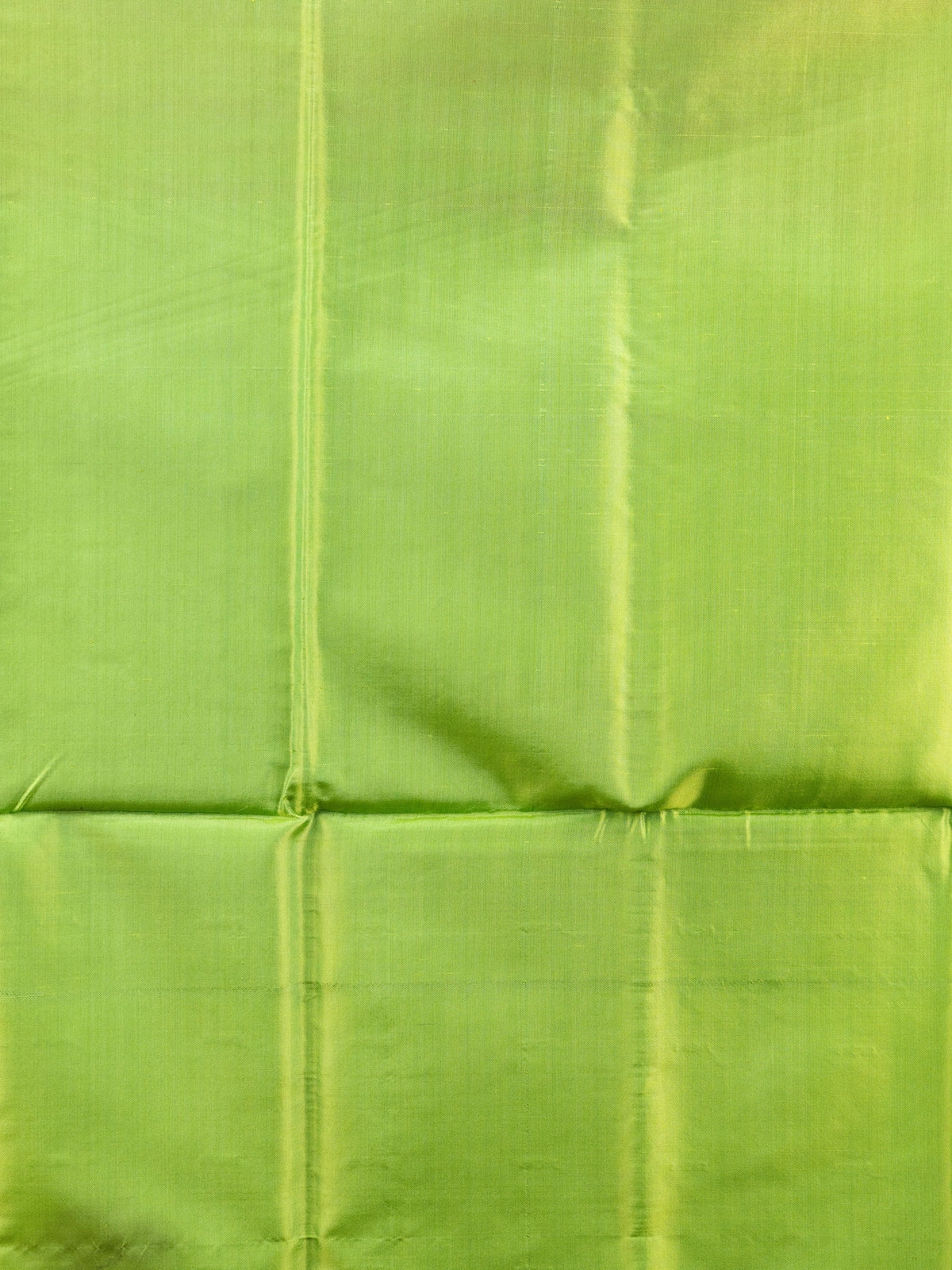 Red Banana silk saree with lime green contrast pallu, gold-copper zari border and woven buttas