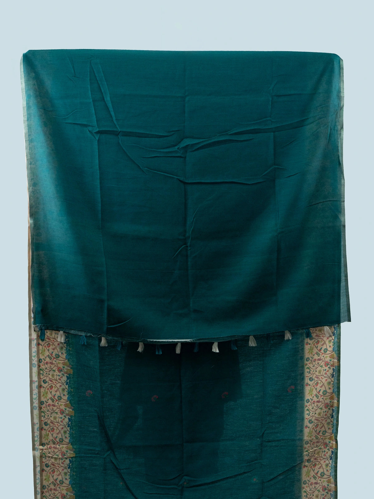 Teal green linen cotton saree with cream multicoloured floral border and black blouse
