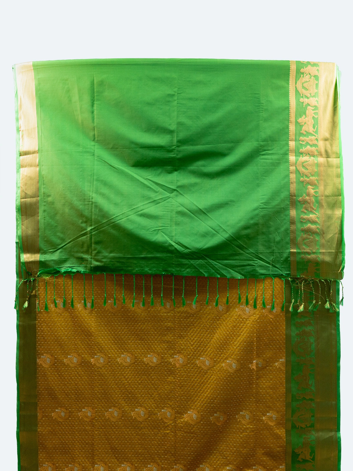 Mustard yellow soft silk saree with contrast green gold zari border and floral motif pallu