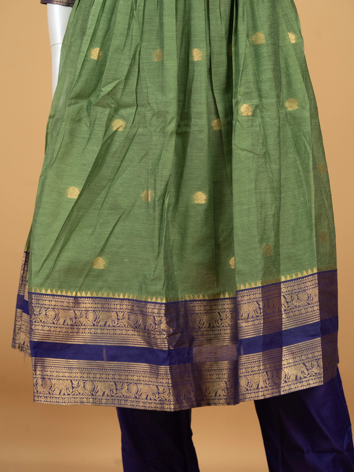 Green cotton silk Anarkali kurti set with navy zari woven yoke, elephant-motif border, and contrast navy dupatta
