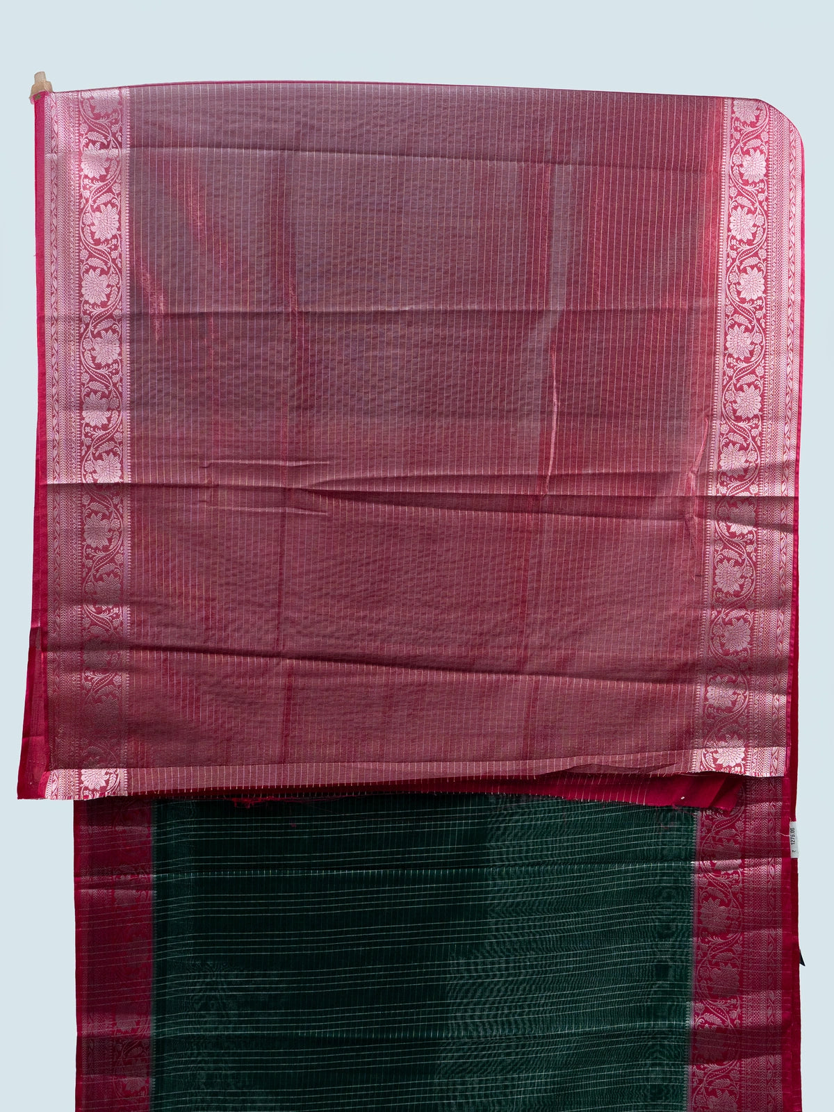 Bottle green semi raw silk saree with silver zari checks and contrast pink floral zari border