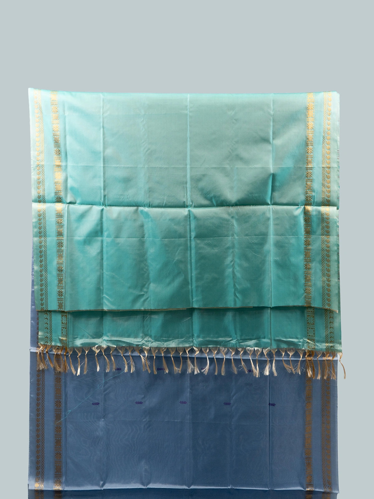 Dusty blue-grey Banana Silk saree with teal green contrast pallu and gold zari border