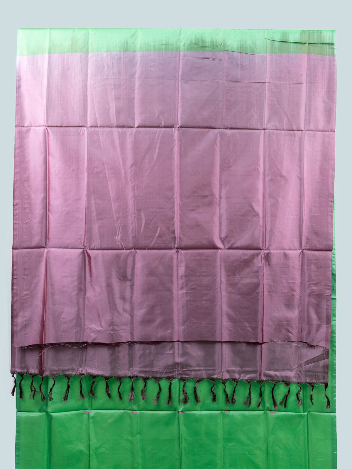 Green banana silk saree with mauve pink contrast pallu, paisley buttas and striped border