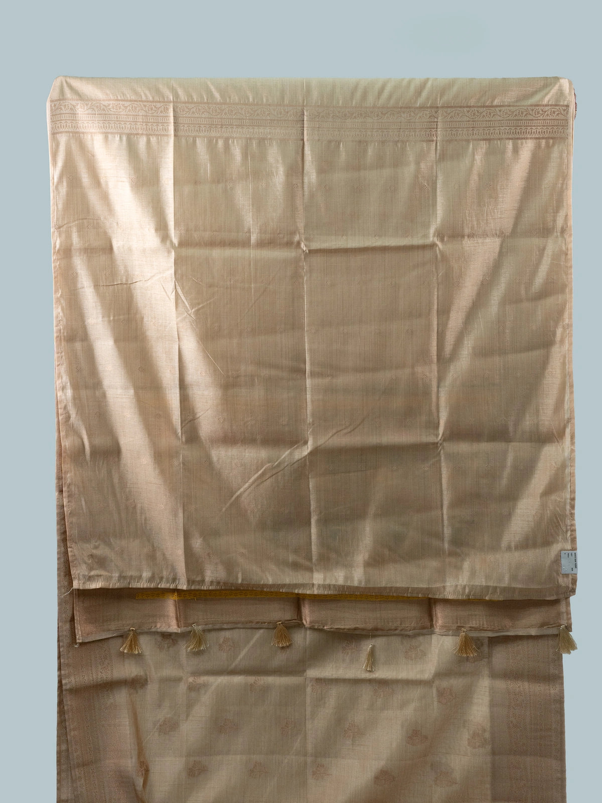 Beige semi raw silk saree with copper zari border and multicolour floral meenakari pallu