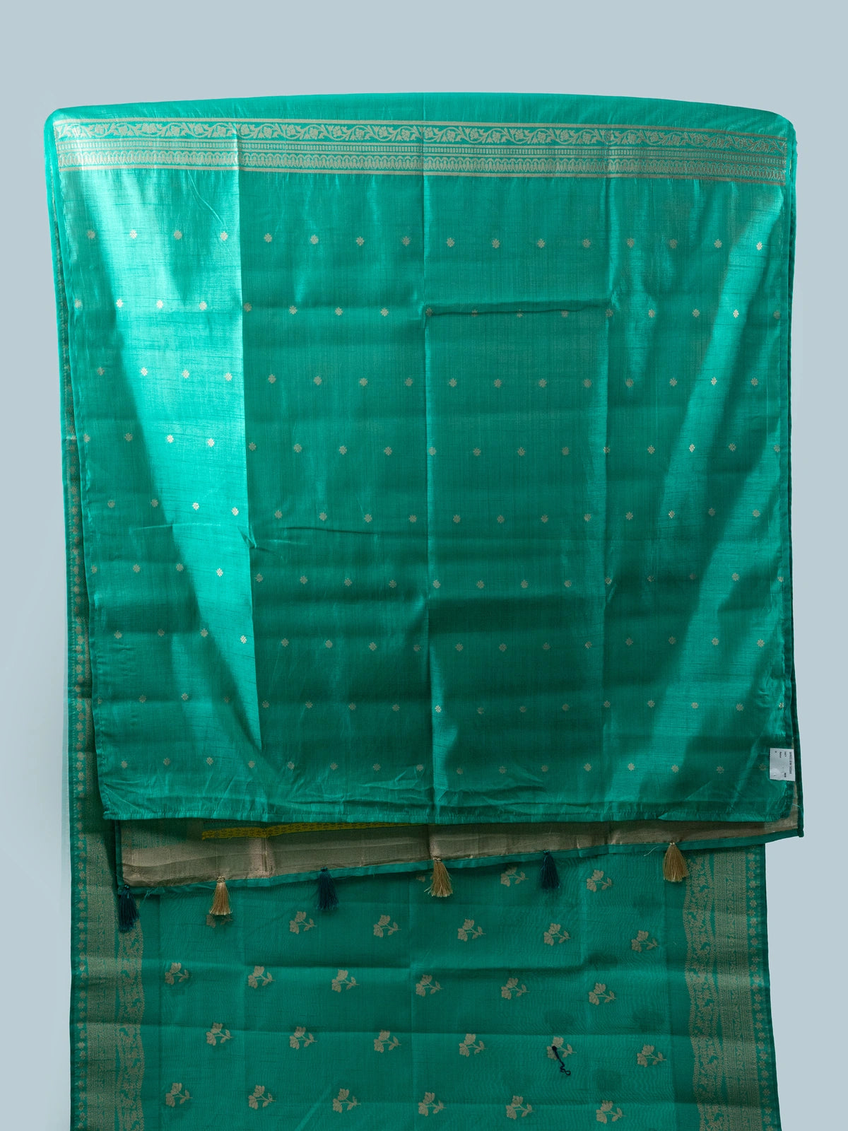 Sea green semi raw silk saree with gold zari floral buttas, contrast zari border and multicolour floral pallu