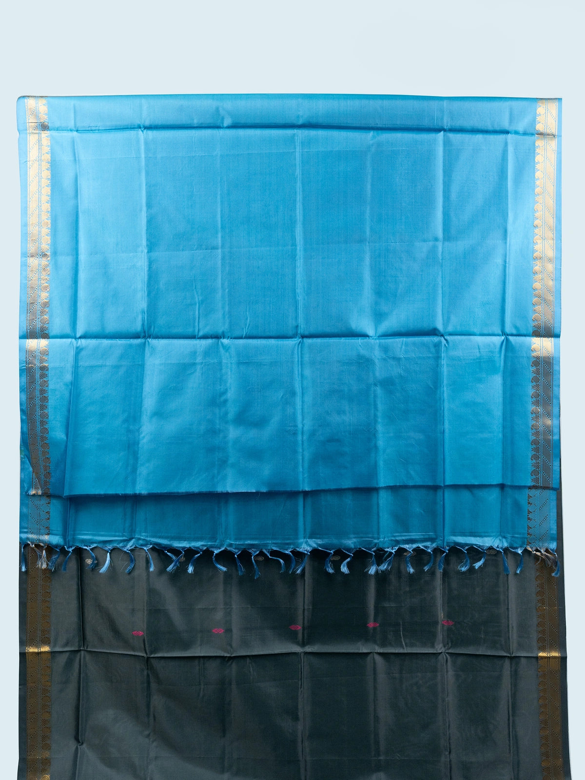 Grey silk saree with contrast blue pallu, gold zari border and black embroidered blouse