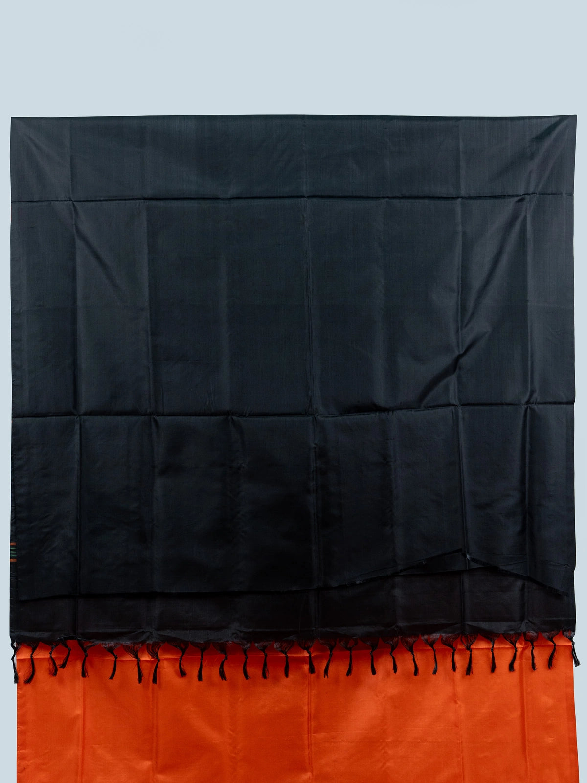 Orange Banana Silk saree with contrast black striped pallu, gold zari buttas and embroidered black blouse
