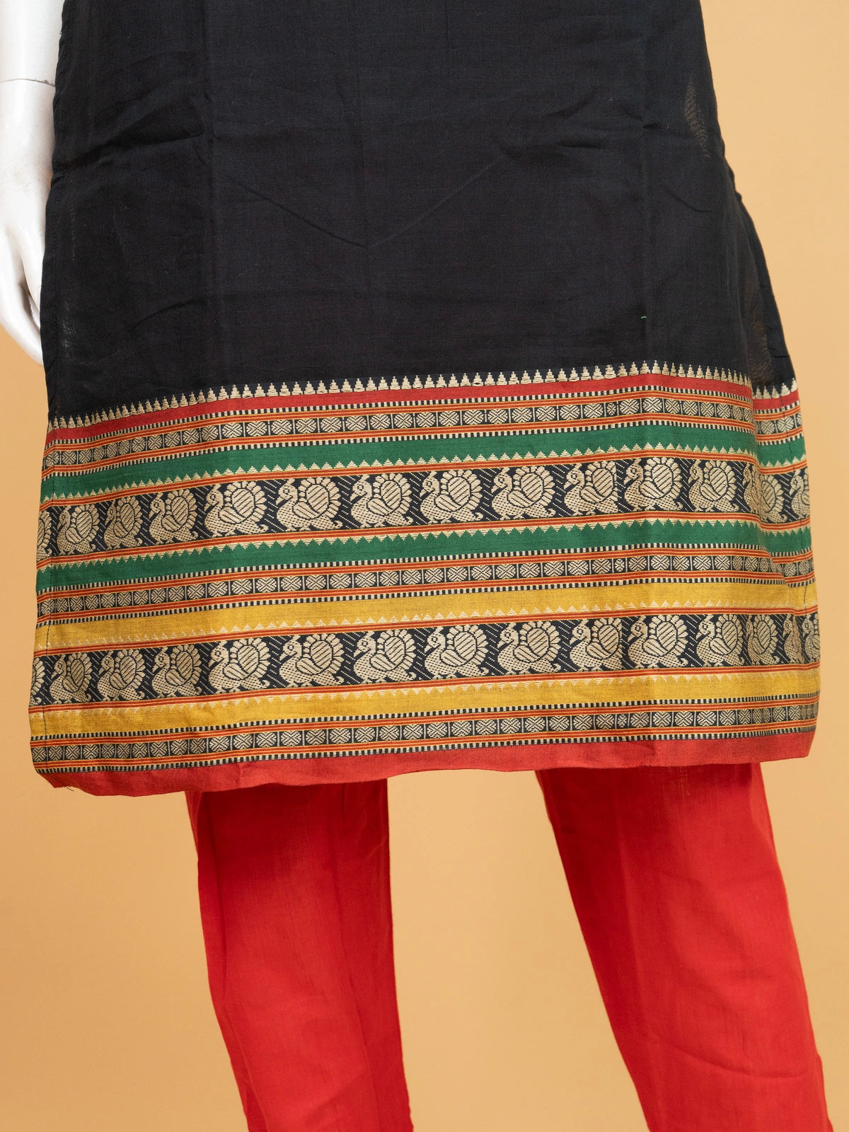 Black cotton straight cut kurti set with peacock woven borders, red pants and multicolour dupatta