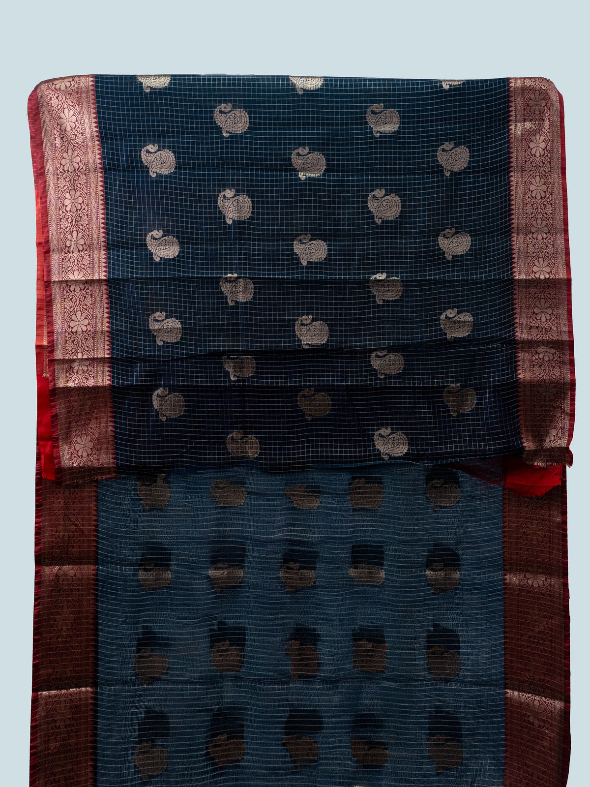 Navy blue semi raw silk saree with zari checks, gold paisley butta and contrast red zari border
