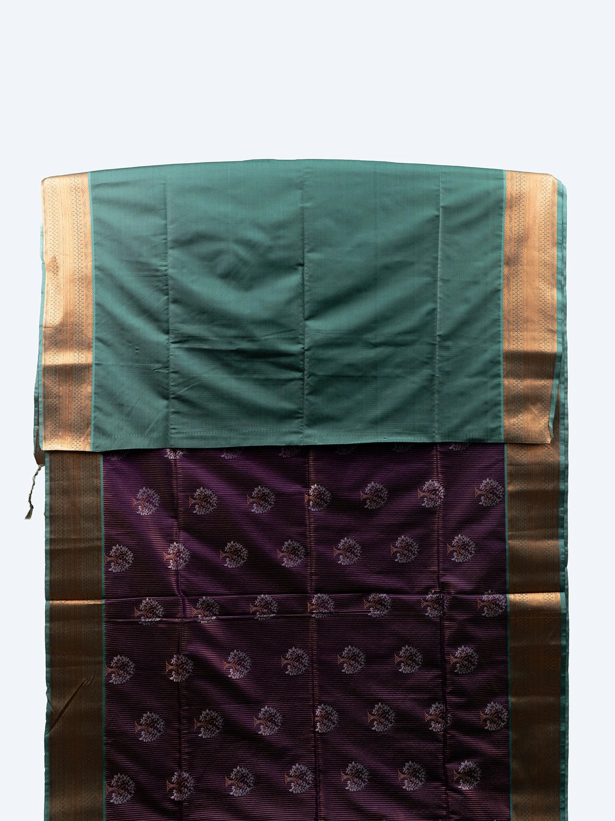 Purple soft silk saree with gold zari tree-of-life motifs and contrast teal pallu