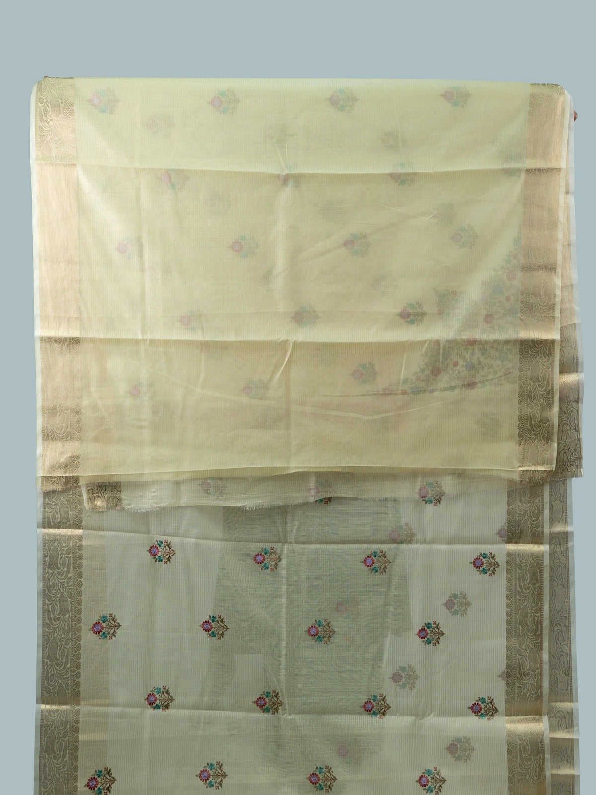 Cream linen cotton saree with gold zari border and multicoloured floral embroidered butas