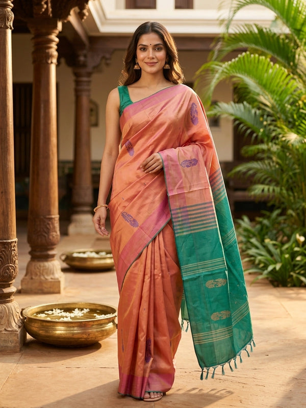 Peach pink and teal green banana silk saree with gold zari buttas and contrast striped pallu