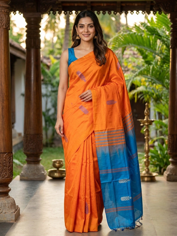 Orange banana silk saree with contrast blue pallu, woven buta motifs and silver zari leaf border