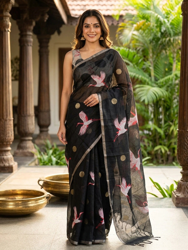 Black linen cotton saree with red and white crane prints, tonal circle motifs and a silver zari border