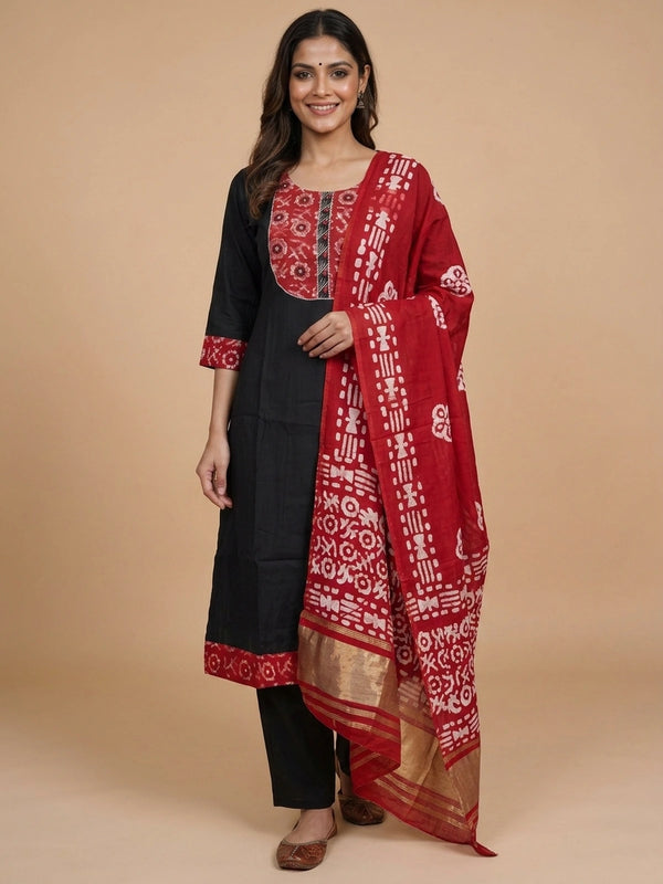Black A-line cotton kurti set with red batik-print yoke and zari-bordered dupatta