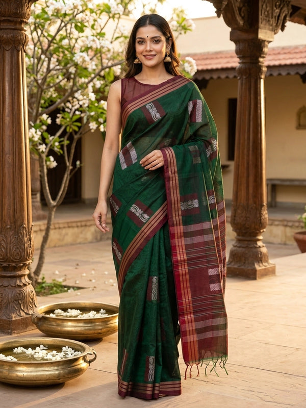 Dark green silk cotton saree with contrast maroon border, copper-gold stripes and silver woven buttas