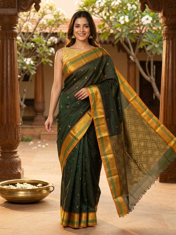 Dark green Chettinad cotton saree with mustard gold zari border and woven floral pallu