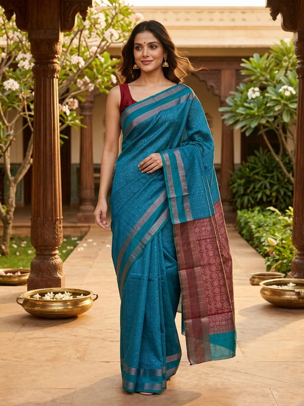 Peacock blue silk cotton saree with silver zari stripes and contrast maroon zari pallu