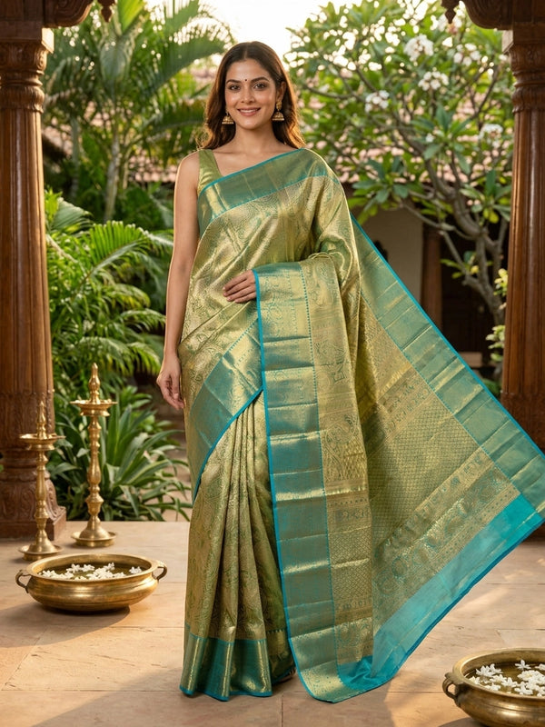 Green pure Kanchipuram silk saree with gold zari brocade body and contrast teal blue zari border