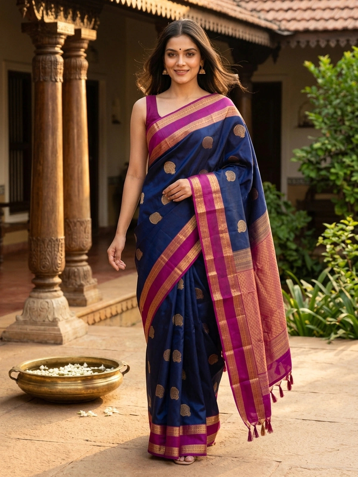 Navy blue pure Kanchipuram silk saree with magenta contrast border and gold zari buta motifs