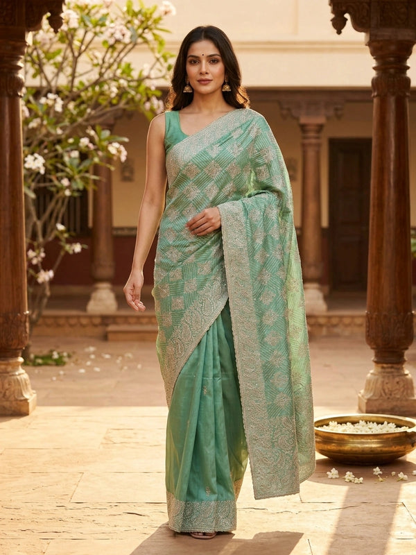Sea green designer organza saree with silver zari and sequin paisley embroidery and embellished border