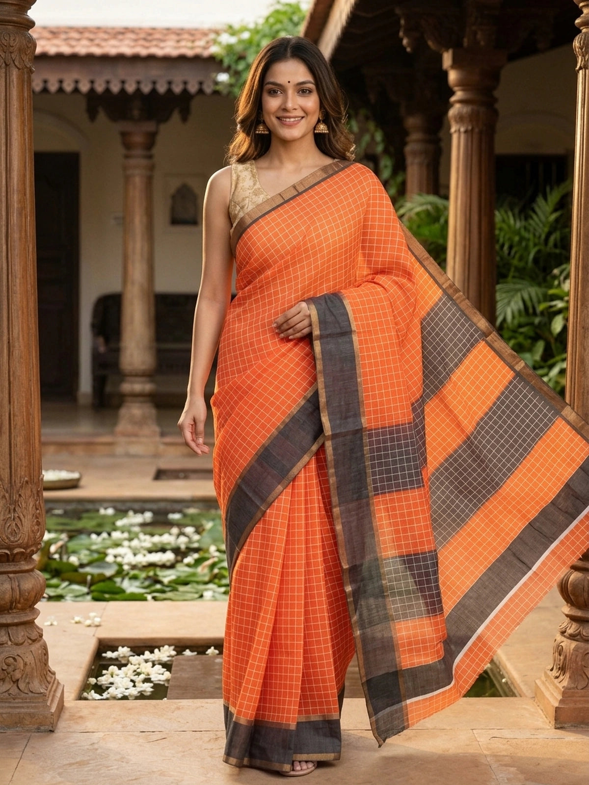 Orange linen cotton saree with white checks, contrast grey checked border and striped pallu