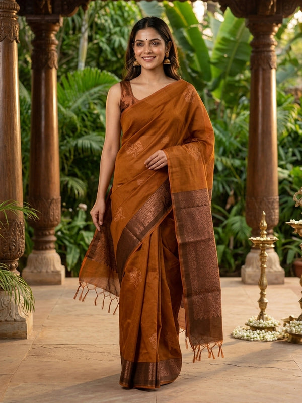 Mustard silk cotton saree with contrast dark brown copper zari border and woven buttas