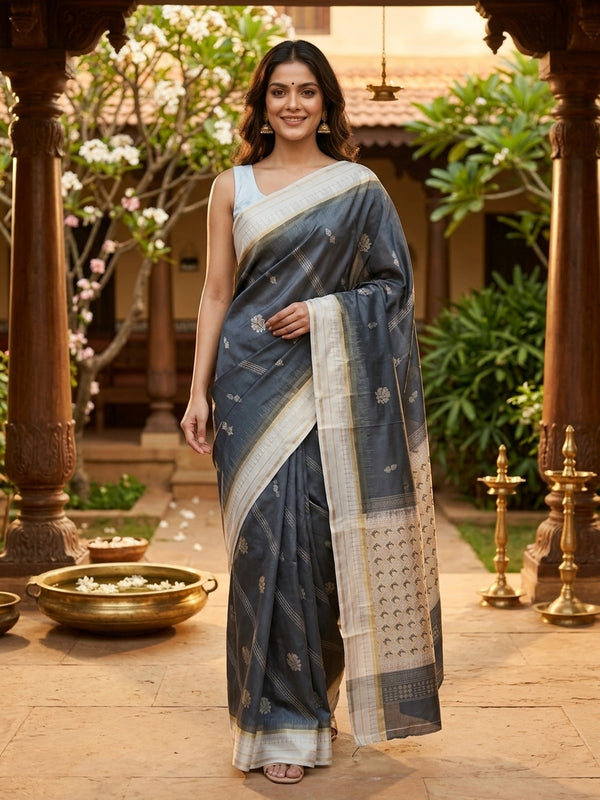 Grey Dola silk saree with cream gold zari border and floral buttis