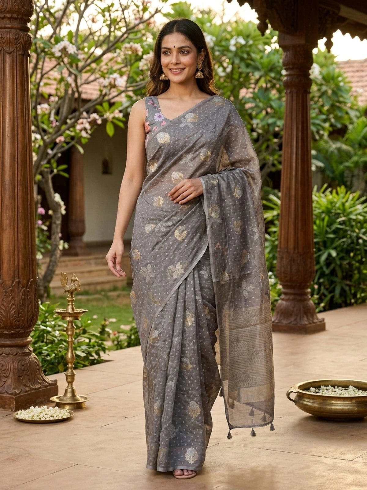 Grey designer saree with gold and silver woven floral buttas and a golden zari tissue border