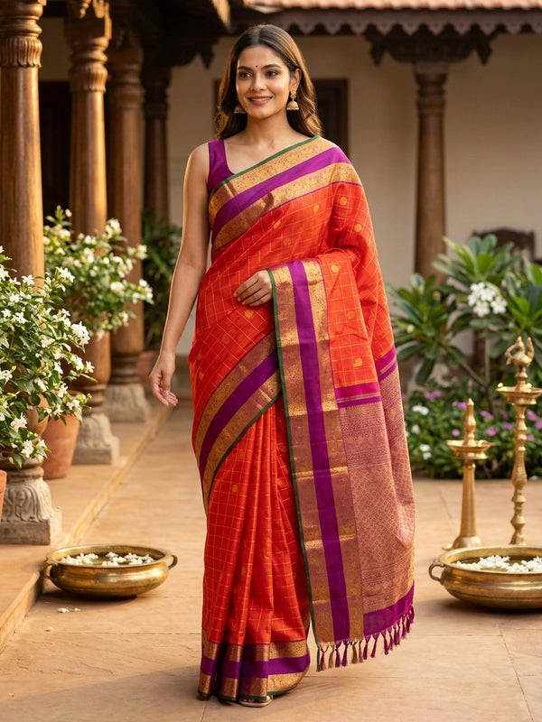 Orange pure Kanchipuram silk saree with magenta contrast gold zari border and brocade pallu