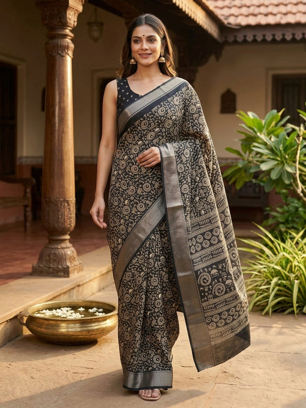 Black designer saree with cream Warli tribal art print and silver zari chevron border