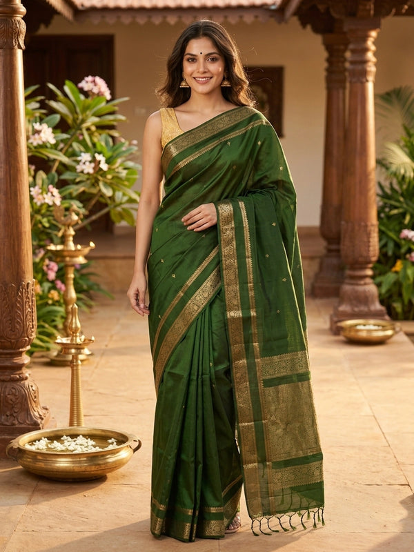 Dark green soft silk saree with gold zari floral border and buttis