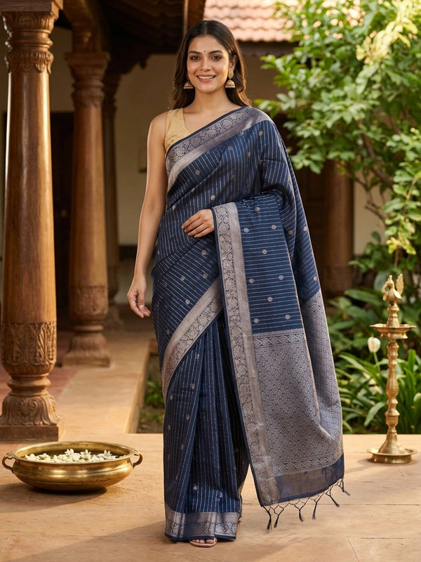 Navy blue silk cotton saree with silver zari stripes, buttis and ornate zari border