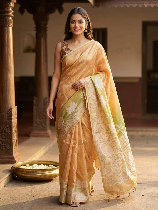 Mustard gold semi tussar saree with green lotus and crane printed pallu and gold zari border