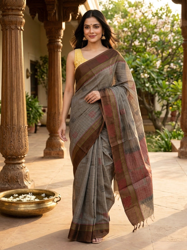 Grey and brown semi raw silk saree with striped body, woven buttas, and contrast temple-motif border