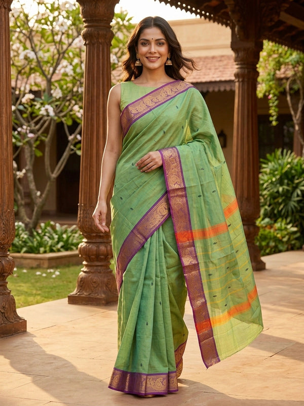 Green Chettinad cotton saree with purple gold zari paisley border and yellow-striped pallu
