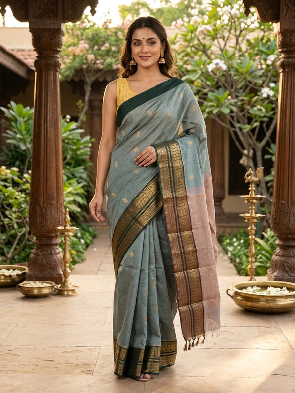 Sage green Chettinad cotton saree with teal gold zari contrast border and paisley buttas