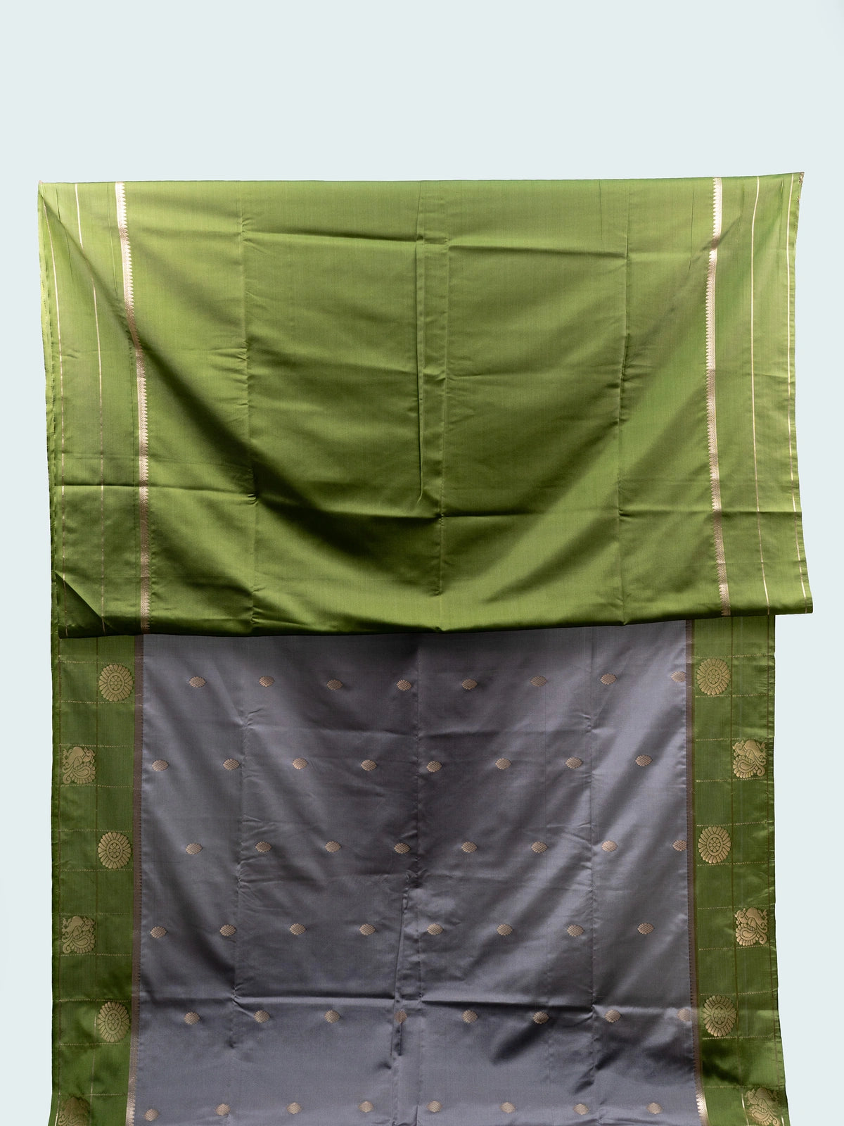 Grey semi silk saree with green contrast gold zari border and floral pallu